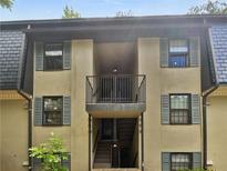 Charming condo exterior with a balcony and staircase at 53 Monet Nw Ct, Atlanta, GA 30327