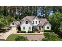 Charming two-story home with attached garage and lush landscaping at 122 Griffin Way, Canton, GA 30115