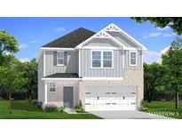 Charming two-story home featuring a brick and gray siding exterior with a two-car garage and well-manicured lawn at 15 Camellia Dr, Fairburn, GA 30213