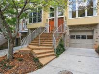 Attractive townhome exterior with brick facade, multiple stories, and inviting staircase at 1323 Peachtree Ne Vw, Atlanta, GA 30319