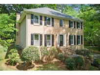 Charming two-story brick home with black shutters and landscaped front yard at 2068 Signal Ridge Nw, Kennesaw, GA 30152