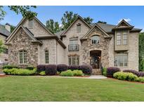Beautiful two-story home with a manicured lawn and professional landscaping at 1942 N Akin Ne Dr, Atlanta, GA 30345