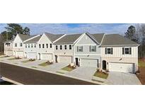 Charming townhomes feature diverse facades, two-car garages, and manicured lawns at 4541 Moray Dr, Mableton, GA 30126