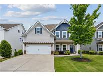 Charming two-story home with a well-manicured lawn and a welcoming front porch at 2624 Chase Rdg, Kennesaw, GA 30144