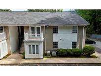 Two-story condo with small deck and stairs on a sunny day at 1212 Utoy Springs Rd # 46, Atlanta, GA 30331