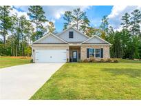 Charming single-story home with a well-maintained lawn, brick accents, and a welcoming front entrance at 426 Samara Ct, Fairburn, GA 30213