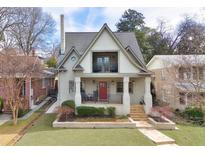 Charming two-story home with landscaped front yard, inviting porch and balcony at 101 Terrace Dr, Atlanta, GA 30305