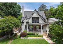 Charming two-story home with a landscaped front yard and inviting front porch at 101 Terrace Dr, Atlanta, GA 30305