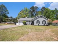 Charming single-story home featuring a well-maintained lawn and inviting curb appeal at 1150 Bonita Cir, Jonesboro, GA 30238