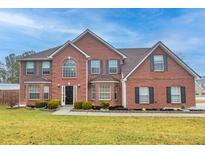 Beautiful two-story brick home with manicured lawn and traditional architectural details at 1439 Alice Ave, Lithonia, GA 30058