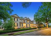 Elegant two-story home showcasing manicured landscaping and classic architectural details at 8109 Lawnview, Alpharetta, GA 30022