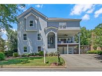 Charming two-story home boasts a unique architectural style, and manicured landscaping at 1420 Cortez Ne Ln, Atlanta, GA 30319