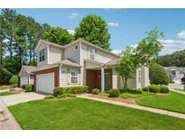 Charming two-story home with well-manicured lawn and inviting curb appeal on a sunny day at 109 Windcroft Nw Cir, Acworth, GA 30101