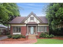 Charming brick home with a gabled roof, manicured landscaping, and inviting front entrance at 96 Dartmouth Ave, Avondale Estates, GA 30002