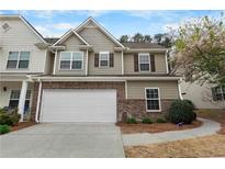 Charming townhome with a two-car garage and inviting curb appeal in a well-maintained community at 331 Franklin Ln, Acworth, GA 30102