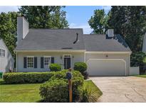 Charming single-Gathering home featuring a two-car garage, a well-manicured lawn, and mature trees at 1175 Haven Brook Ne Way, Brookhaven, GA 30319
