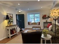 Cozy living room with hardwood floors, window seat, and comfortable seating at 3119 Colonial Way # H, Atlanta, GA 30341