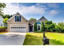 Charming home featuring a well-manicured lawn, classic architecture, and inviting curb appeal at 2721 Maeve Ct, Dacula, GA 30019