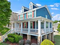 Charming two-story home with blue siding, white trim, and a inviting front porch at 1783 Drew Nw Dr, Atlanta, GA 30318