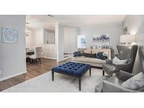 Comfortable living room features stylish seating, decor, and an open floor plan at 5245 Chemin De Vie, Atlanta, GA 30342