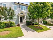 Charming townhome featuring a well-maintained lawn, inviting entrance, and beautiful curb appeal at 1381 Wallace Walk, Atlanta, GA 30316