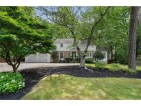 Charming brick home with a well-manicured front yard and mature trees at 4105 Peachtree Dunwoody Ne Rd, Atlanta, GA 30342