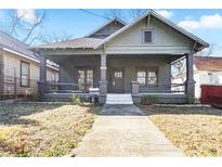 Charming craftsman home with a covered front porch and classic architectural details at 1050 Lawton Sw Ave, Atlanta, GA 30310