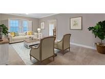 Bright living room with neutral walls, comfortable seating, and a light blue area rug at 3649 Peachtree Ne Rd # 201, Atlanta, GA 30319