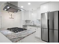 Modern kitchen featuring granite countertops, stainless steel appliances, and white cabinetry at 705 Country Park Se Dr, Smyrna, GA 30080