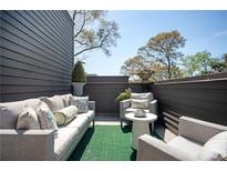 Inviting outdoor patio featuring comfortable seating, lush greenery, and stylish decor at 1821 Huntington Hills Nw Ln, Atlanta, GA 30309
