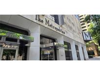 The Metropolitan building features a prominent entrance and classic architectural details at 20 Marietta Nw St # 16A, Atlanta, GA 30303