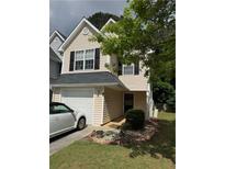 Charming two-story home featuring an attached garage, well-manicured lawn and simple landscaping at 6820 Gallant Se Cir # 2, Mableton, GA 30126
