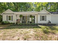 Charming single-story home featuring a welcoming front porch and a well-manicured front yard at 121 Danielle Ct, Villa Rica, GA 30180