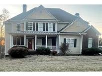 Charming two-story home with a welcoming front porch and well-maintained landscaping at 2532 Greenes Ln, Powder Springs, GA 30127