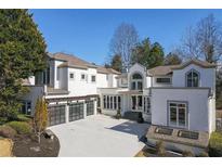 Stunning modern home with a three-car garage and beautiful architectural details at 255 Northland Ridge Trl, Atlanta, GA 30342