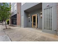 Modern building entrance features a glass-block design and contemporary lighting at 660 Glen Iris Dr # 206 & 109, Atlanta, GA 30308