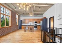 This open concept kitchen features stainless appliances, wood cabinets and countertops, and industrial-style accents at 660 Glen Iris Dr # 206 & 109, Atlanta, GA 30308