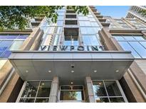 Contemporary building entrance features a modern design and prominent signage at 855 Peachtree Ne St # 1311, Atlanta, GA 30308