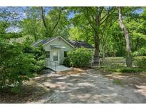 Charming home with mature trees, sidewalk and ample parking space at 4202 Maplewood Dr, Decatur, GA 30035