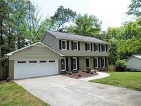 Charming two-story home with a two car garage and a well-manicured lawn at 1315 Arden Sw Dr, Marietta, GA 30008