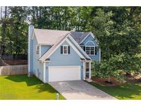Charming two-story home with a well-manicured lawn and a classic suburban appeal at 1065 Dalby Way, Austell, GA 30106