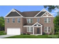 Charming two-story brick home with a landscaped yard and attached two-car garage at 2780 Dolce Rd, Dacula, GA 30019