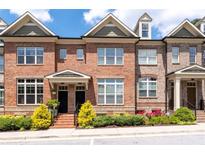 Charming brick townhouse with manicured landscaping and inviting front entrance at 1222 Lavista Ne Cir, Atlanta, GA 30324