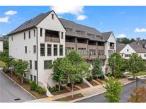 Stylish townhomes showcase attractive facades, professional landscaping, and inviting streetscapes at 6763 Encore Blvd, Atlanta, GA 30328