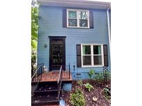 Charming home featuring a classic black front door and well-maintained brick steps at 260 Manning Sw Rd # 42, Marietta, GA 30064