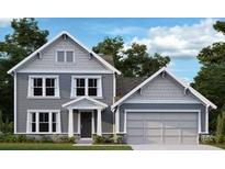 Charming two-story home featuring a classic gray exterior, well-manicured lawn, and attached two-car garage at 155 Pickens Bluff Ln, Hiram, GA 30141