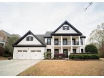 Stunning two-story home featuring a welcoming porch and a two-car garage at 21 Whitegrass Way, Grayson, GA 30017