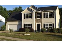 Charming two-story home with a well-manicured lawn and attached two-car garage at 1371 Blazing Star Rd, Lawrenceville, GA 30045