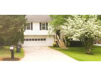 Charming two-story home featuring a well-manicured lawn and a two-car garage at 2811 Country Farms Ct, Snellville, GA 30039