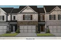 Charming townhome featuring brick accents, attached garages, and well-manicured landscaping at 1195 Park Center Cir, Austell, GA 30168